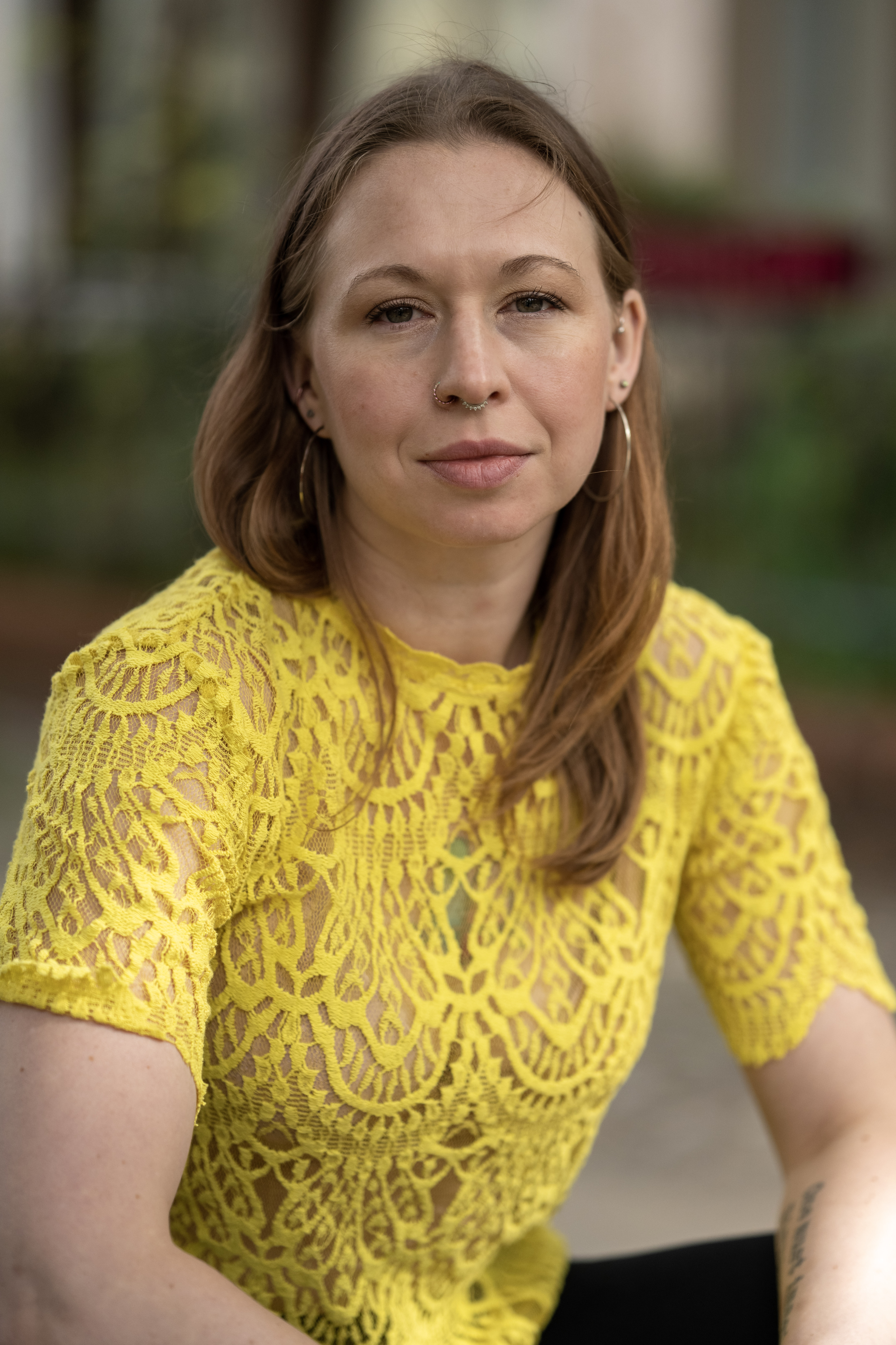Jules wearing a yellow lace top
